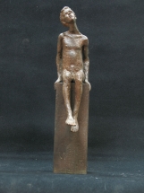 niño fundido en bronce