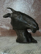 cabeza de cabra en bronce